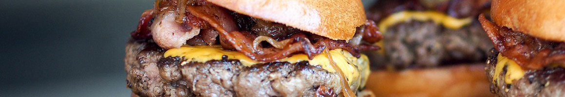 Eating Burger Hot Dog Sandwich at Johnny's Hots restaurant in Philadelphia, PA.
